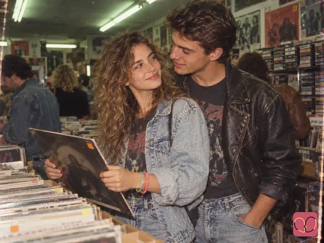 1980s couple photo — A couple browses vinyl records together in a record store